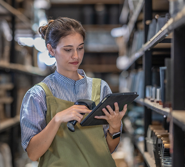 Woman checking inventory in a cannabis dispensary